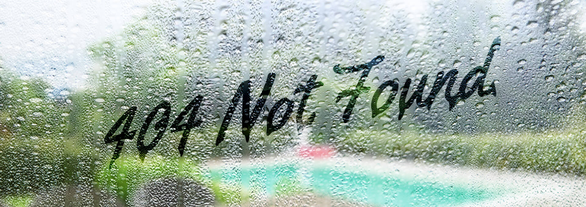 A fogged up rainy window with '404' written on it.