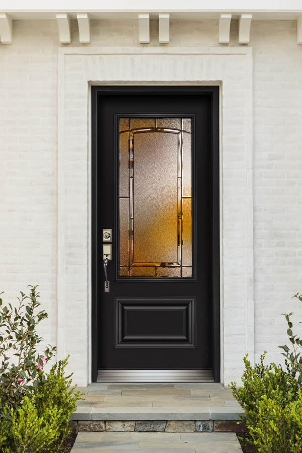 A black entry door with Concord glass inserts on an Orleans door slab.