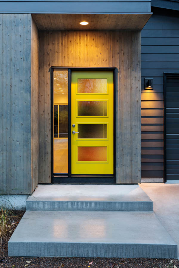 A modern, yellow entry door with Corduroy glass inserts on a Flat door slab.
