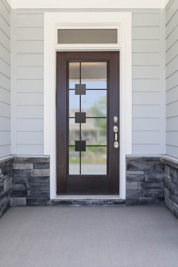 An entry door with Piano glass inserts on a Flat door slab.