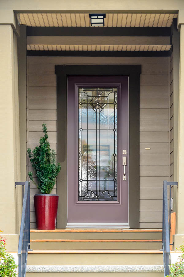 A purplish grey entry door with Waterton glass inserts on a Flat door slab.