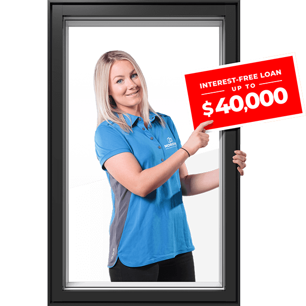 A Nordik windows sales rep points at a savings graphics that says interest-free load up to $40,000.