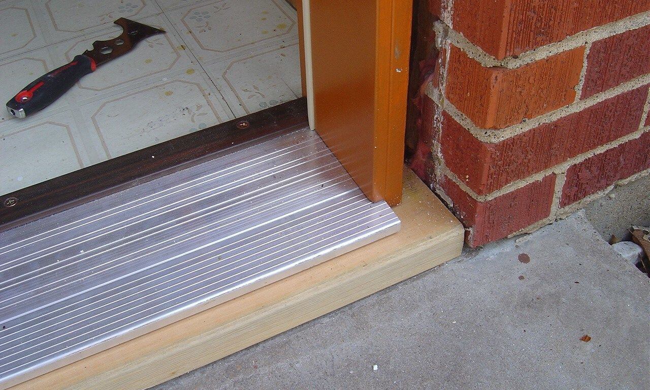 Thresholds sit under the door.