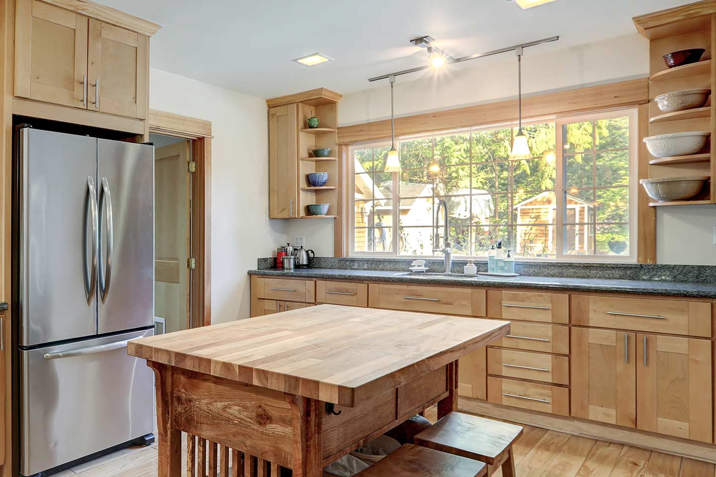 double slider window with two operable sashes above a kitchen counter with sink Frame