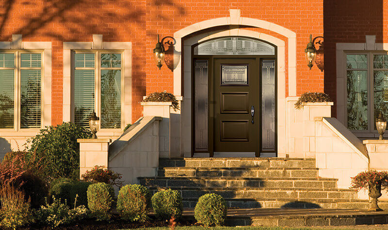 Modern steel entry door with extended arch transom