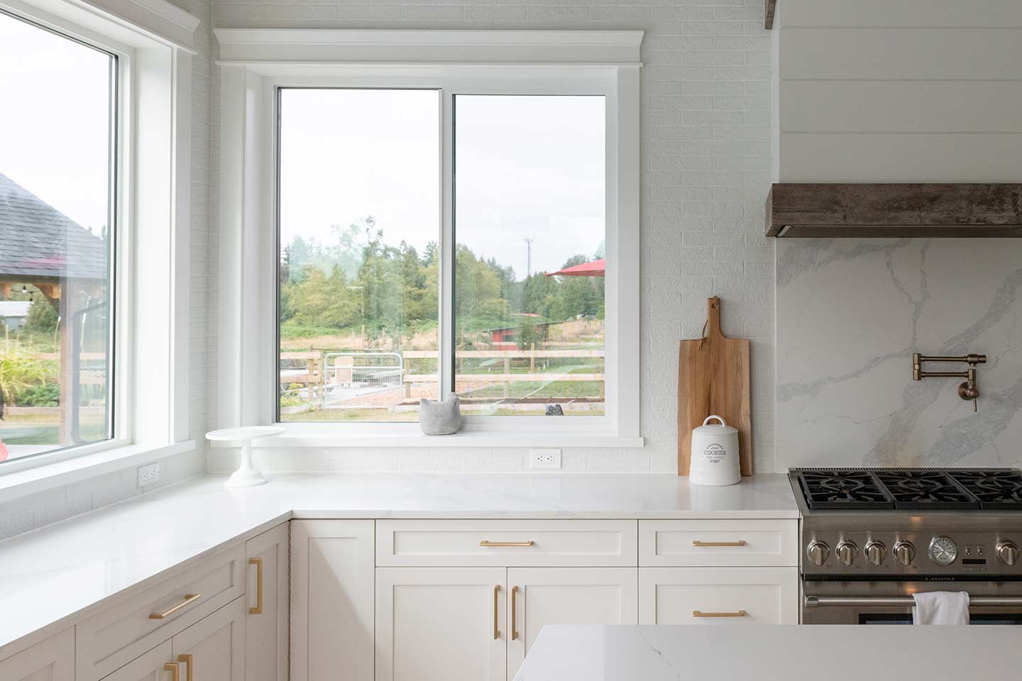 double slider window with two operable sashes above a kitch counter with sink Frame